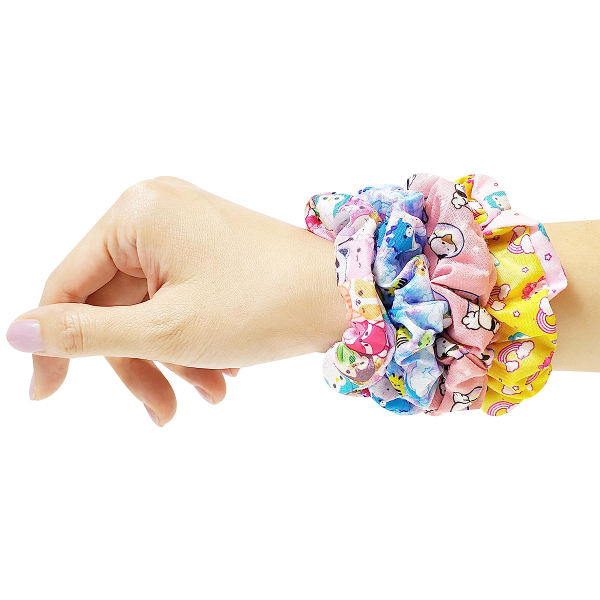 Close-up of LUV HER scrunchy with character print
