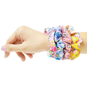 Close-up of LUV HER scrunchy with character print