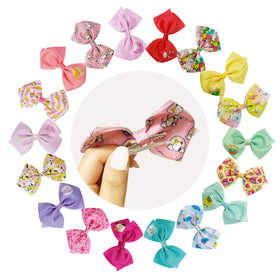 Close-up of LUV HER Squishmallows hair bow clips with character designs