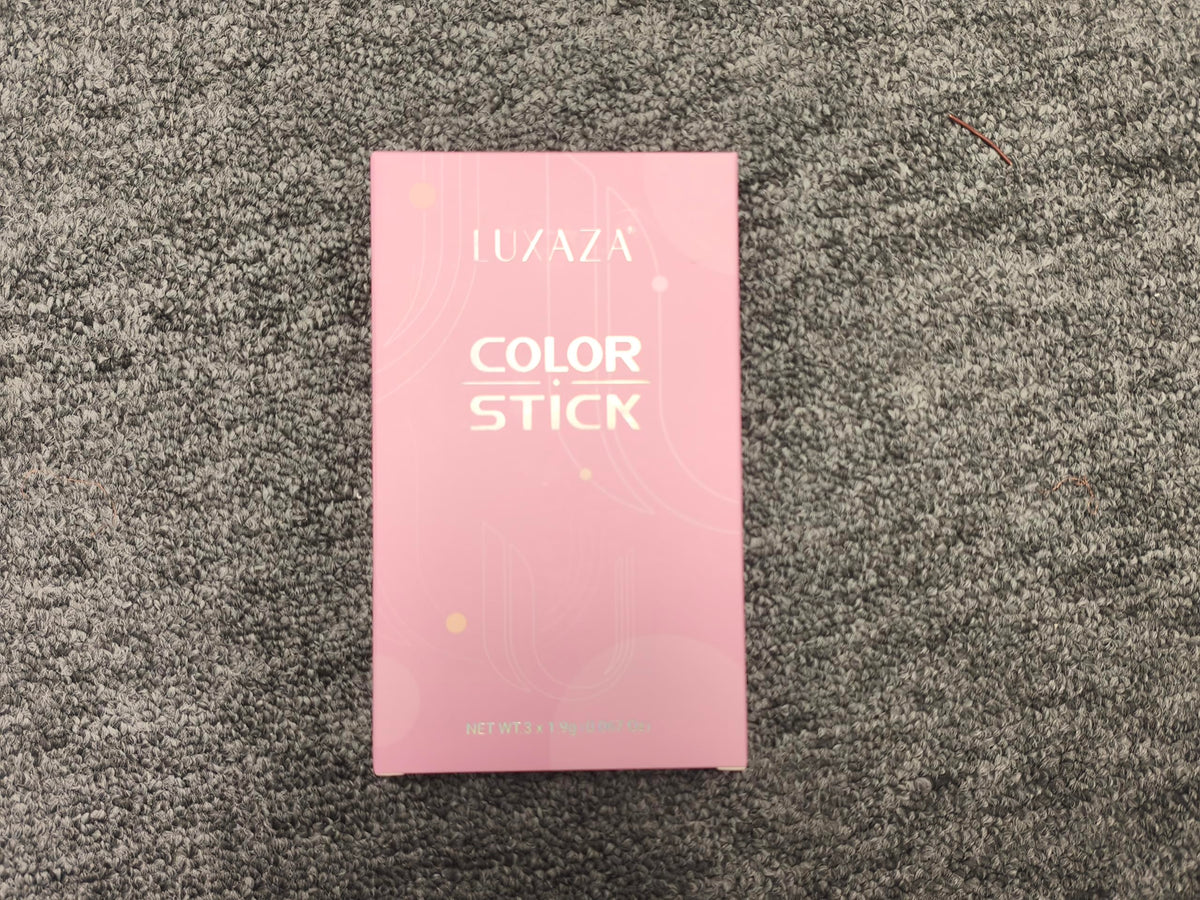 Close-up of LUXAZA Cream Eyeshadow Stick showing matte metallic finish
