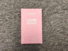 Close-up of LUXAZA Cream Eyeshadow Stick showing matte metallic finish