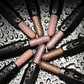 Close-up of LUXAZA PRO eyeshadow stick with blending brush