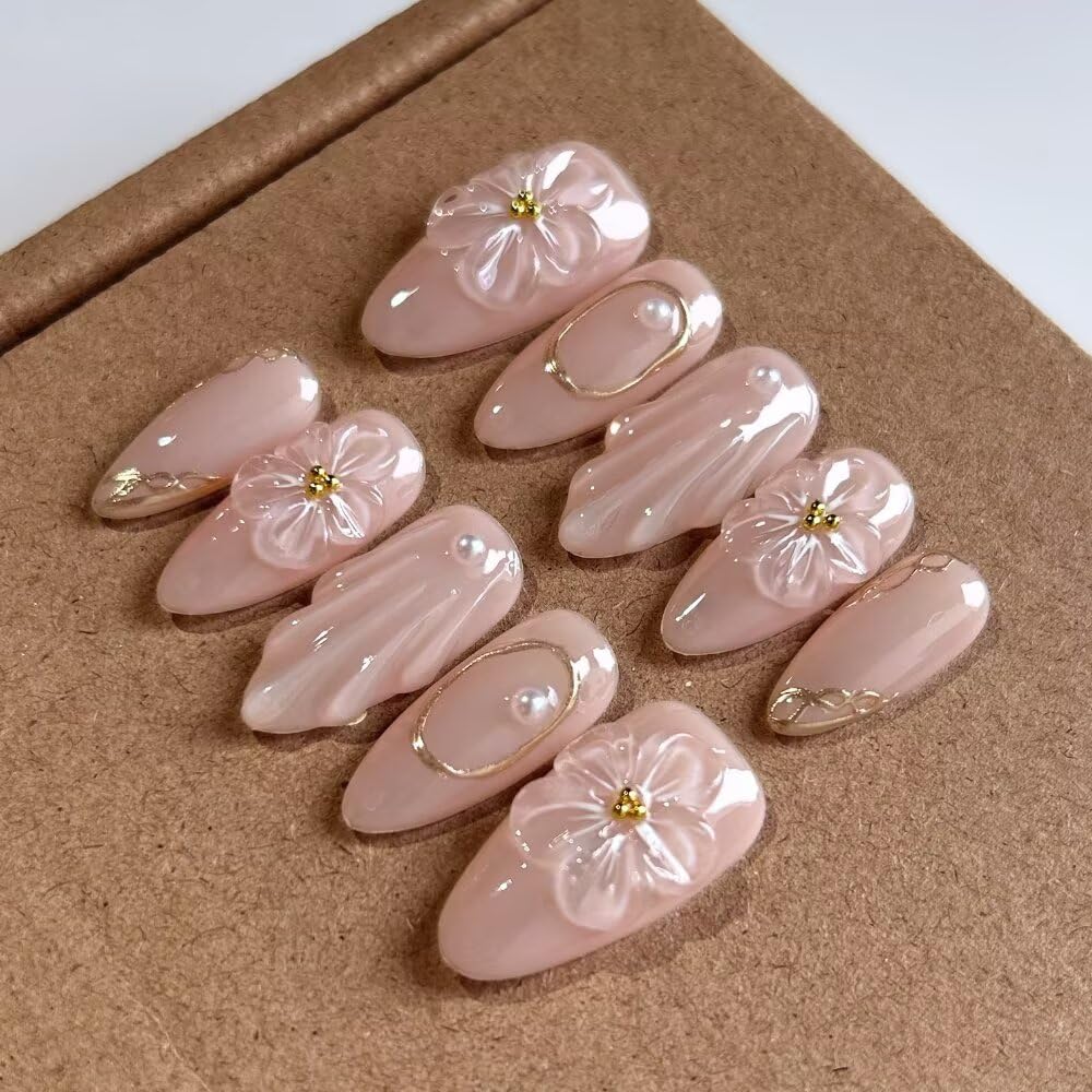 Close-up of MAGLFELL press on nails with floral design