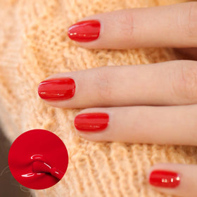 Close-up of Manucurist Green Poppy Red Nail Polish brush
