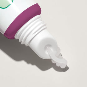 Close-up of Mario Badescu lip balm texture on a fingertip