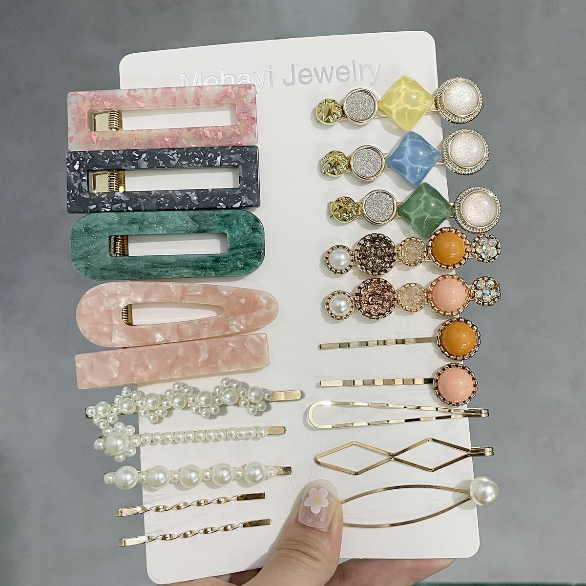 Close-up of Mehayi pearl hair clips with geometric designs