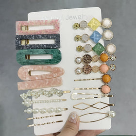 Close-up of Mehayi pearl hair clips with geometric designs