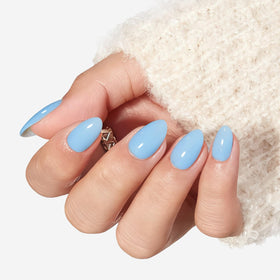 Close-up of modelones Blue Short Press on Nails with nail glue and adhesive tabs