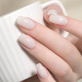 Close-up of modelones nude pink nail strengthener bottle