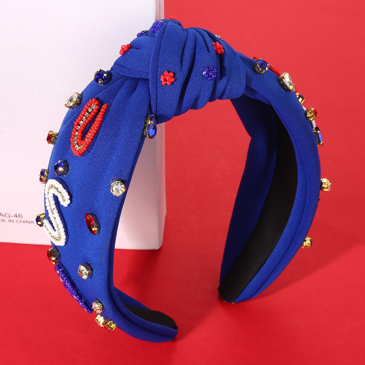 Close-up of MOLOCH headband showing red, white, blue design