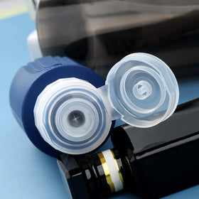 Close-up of Mrsdry travel bottle showing the leak-proof cap