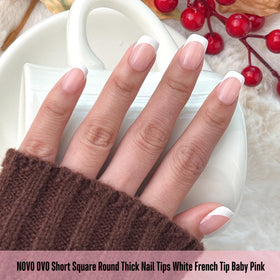 Close-up of NOVO OVO Baby Pink Short Square Round French Tip Nail Tips