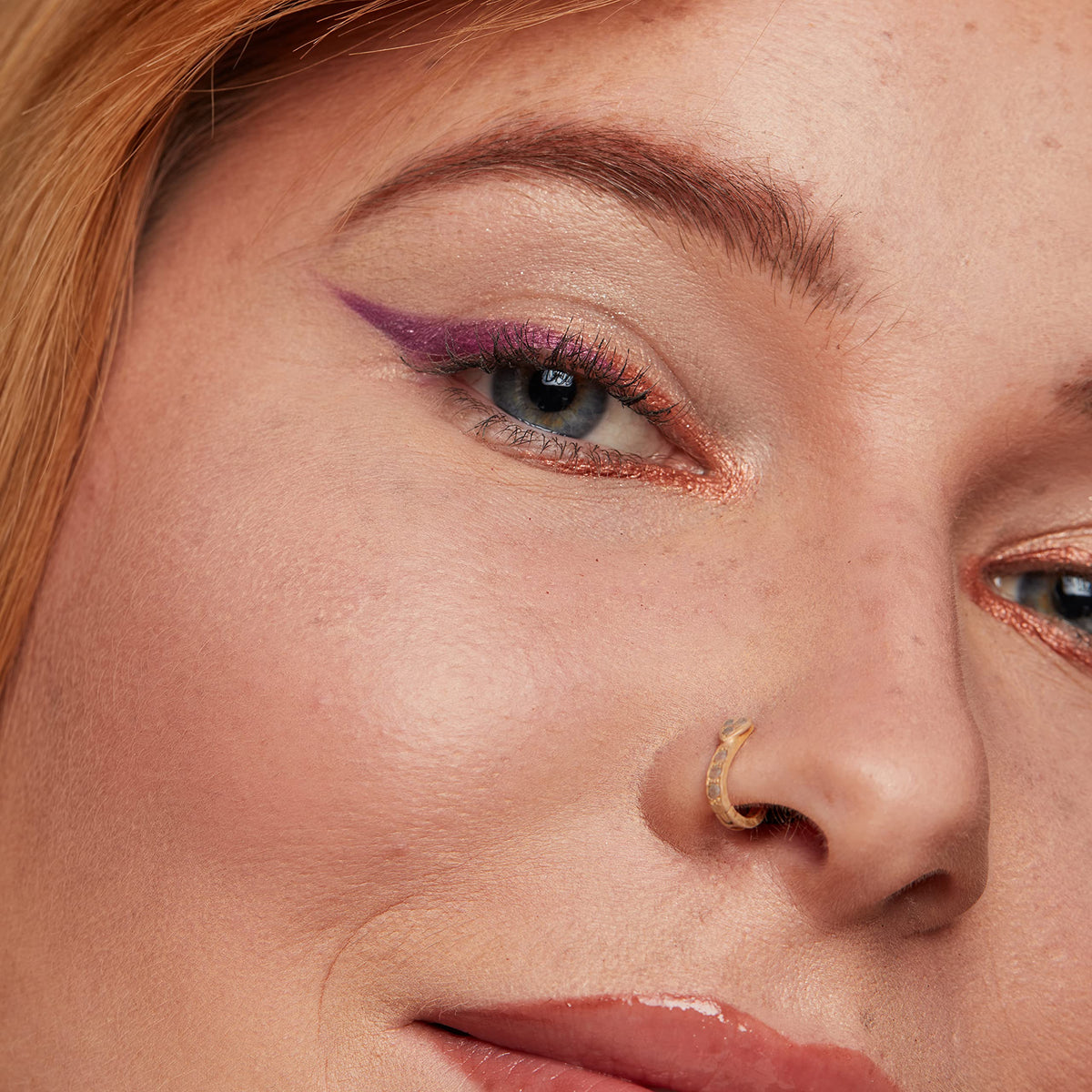 Close-up of NYX eyebrow pomade pencil in Auburn shade