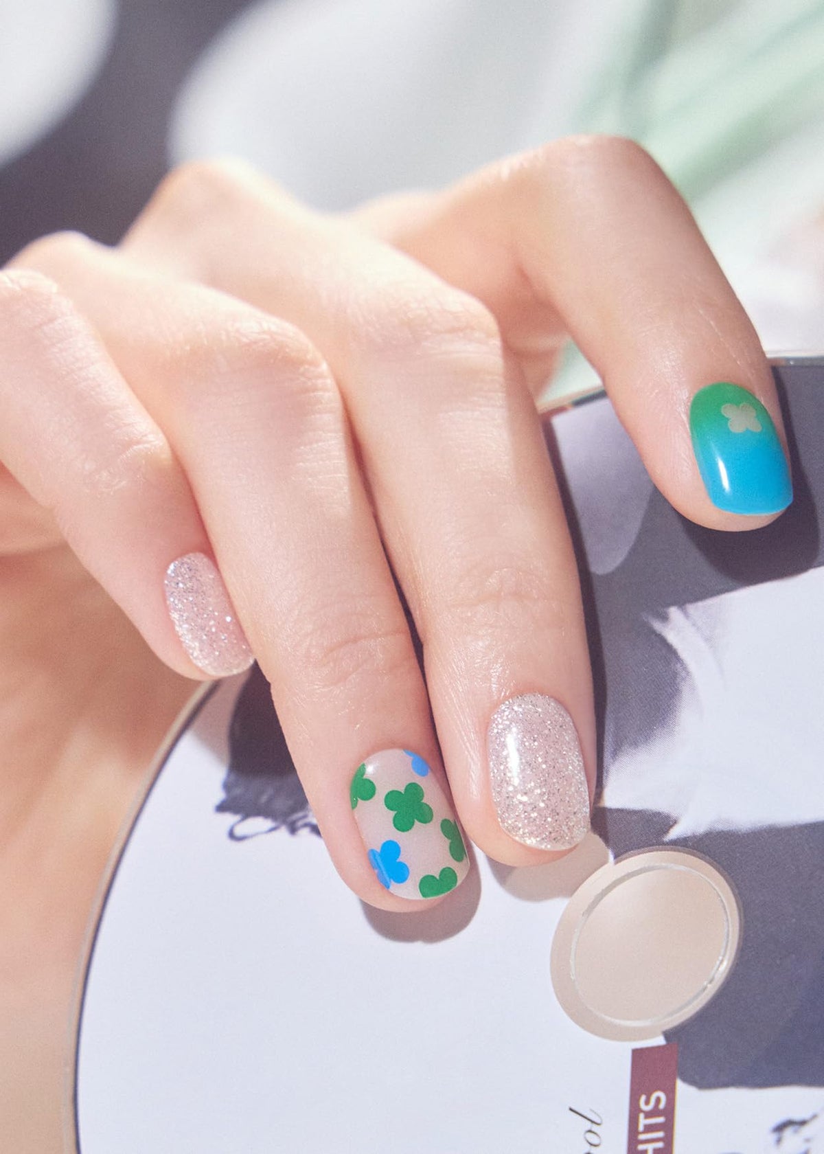 Close-up of ohora Semi Gel Nail Strips showing various designs