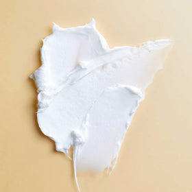 Close-up of PATTERN Styling Cream jar showing creamy consistency