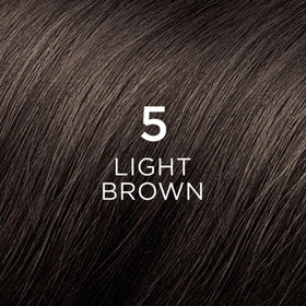 Close-up of PHYTO Phytocolor 5 Light Brown hair dye application