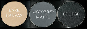 Close-up of Pure Ziva eyeshadow shades: off white, grey blue, and glitter black