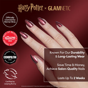 Close-up of scarlet red chrome nails with Gryffindor graphics