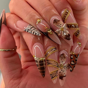 Close-up of SEENEEY Almond Press on Nails showing detailed floral pattern