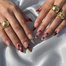Close-up of SEENEEY Almond Press on Nails showing floral design