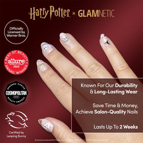 Close-up of semi-transparent Hogwarts graphic nails