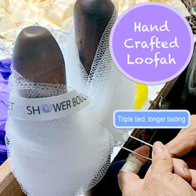 Close-up of Shower Bouquet soft mesh loofah showing triple-tied knot