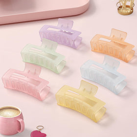 Close-up of Sisiaipu medium hair claw clip in yellow