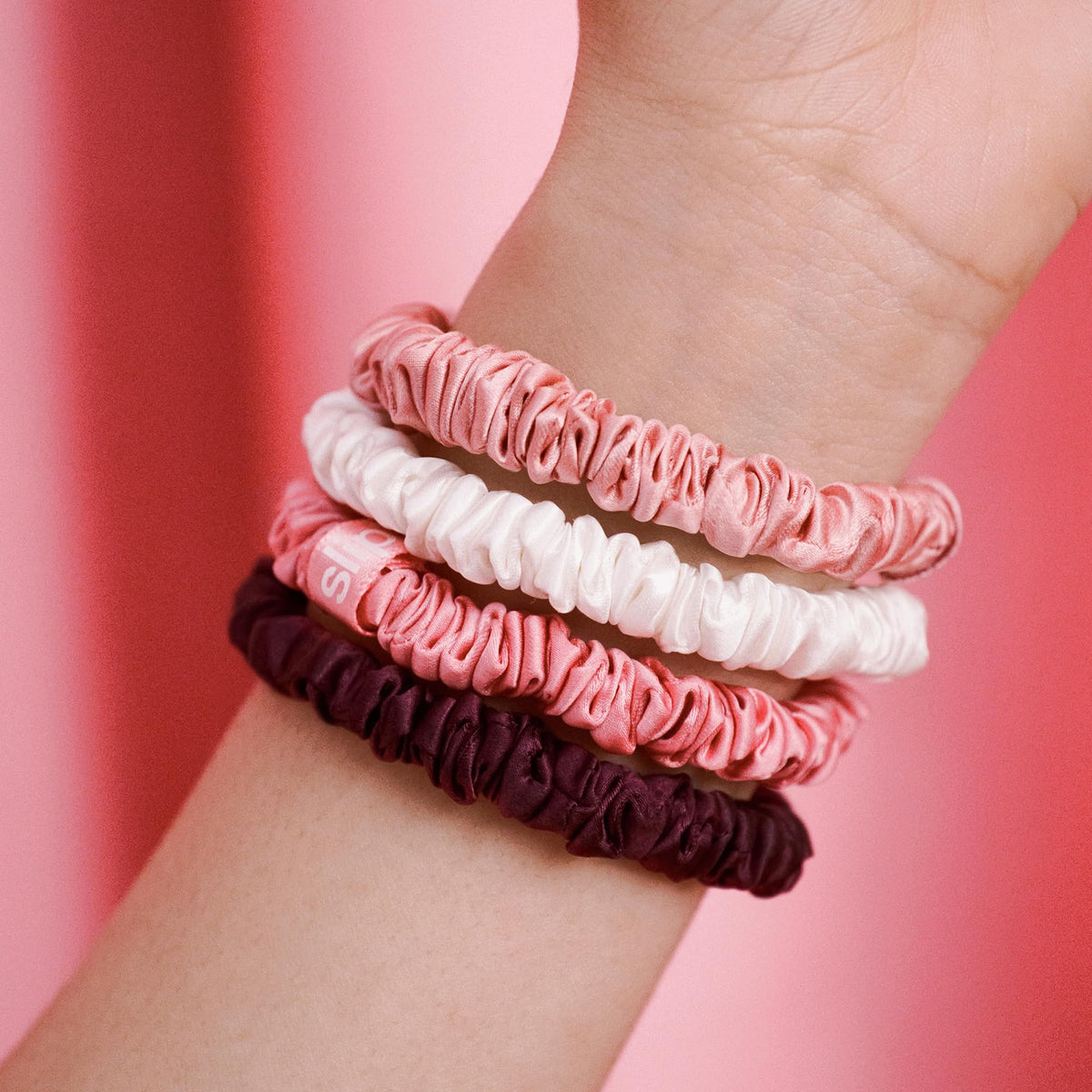 Close-up of SLIP scrunchies showing soft silk texture