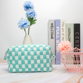 Close-up of soft knit fabric of PAZIMIIK Checkered Makeup Bag