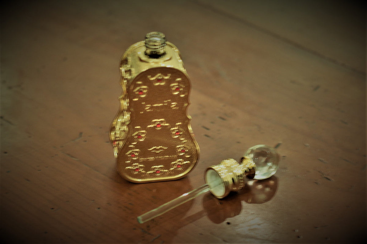 Close-up of Swiss Arabian Jamila perfume oil bottle