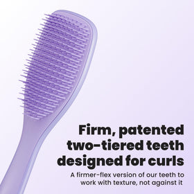 Close-up of TANGLE TEEZER brush showing firm-flex teeth