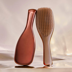 Close-up of TANGLE TEEZER Chrome Ultimate Detangler Brush showing teeth design