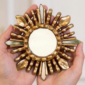 Close-up of the bronze leaf finish on the sunburst mirror
