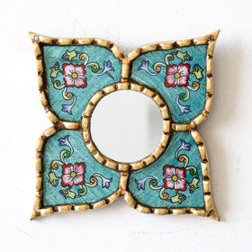 Close-up of the bronze leaf frame on DecorContreras mirror