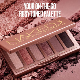 Close-up of URBAN DECAY Naked3 Mini Eyeshadow Palette with swatches