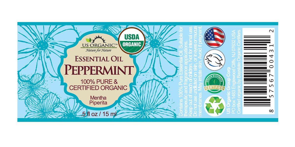 Close-up of US Organic Peppermint Essential Oil bottle with dropper