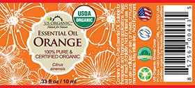 Close-up of US Organic Sweet Orange Essential Oil bottle with dropper