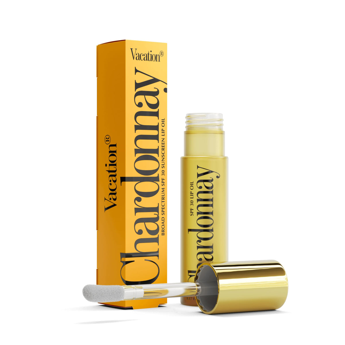 Close-up of VACATION Lip Oil SPF 30 showing applicator