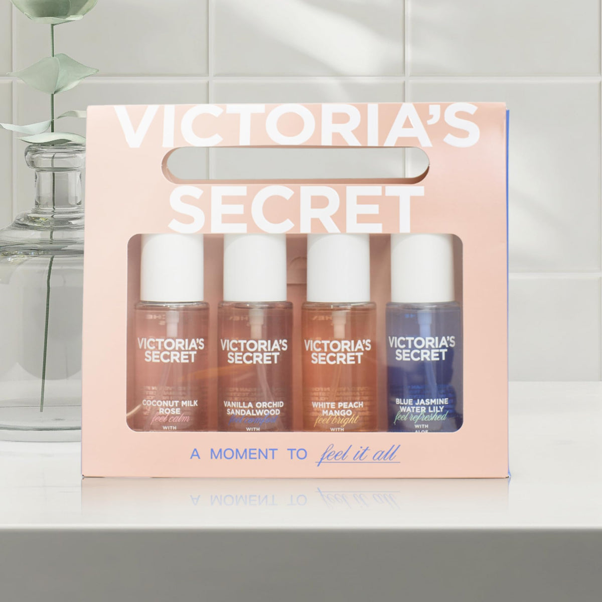 Close-up of Victoria's Secret Coconut Milk Rose mini mist bottle