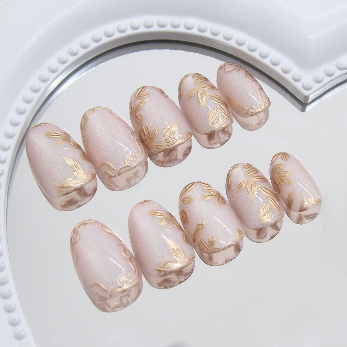 Close-up of XZMeiLun Gold Leaf Press On Nails showing intricate design