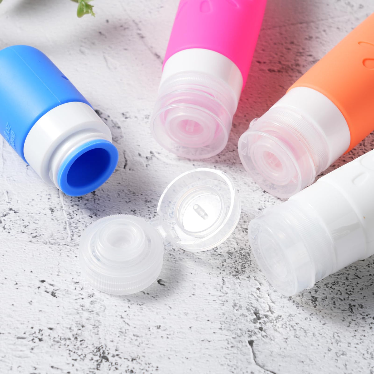 Close-up of Zafit silicone travel bottles with labels