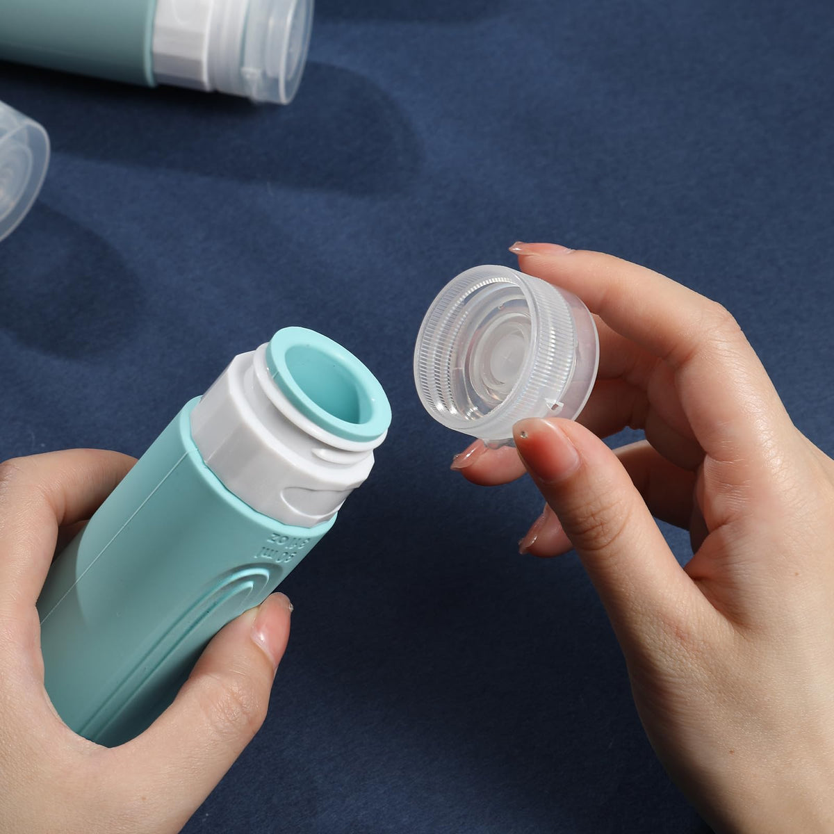 Close-up view of CHEODIN travel bottle with wide opening for easy filling