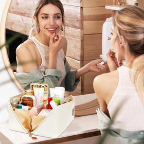 CLOUDWINGS Initial Makeup Bag displayed with beauty tools