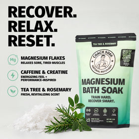 Coach Soak Magnesium Bath Soak displayed with a towel and candles