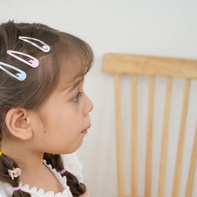 cocplok hair clips in use on a child's hairstyle