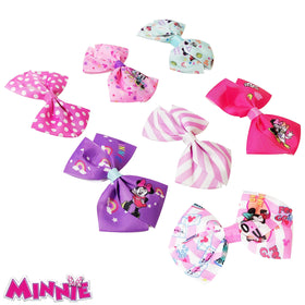 Colourful Minnie Mouse hair bows arranged on a card