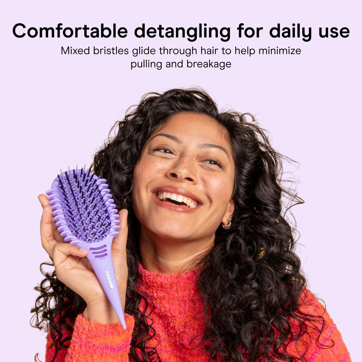 Conair Detangling Brush in use on curly hair