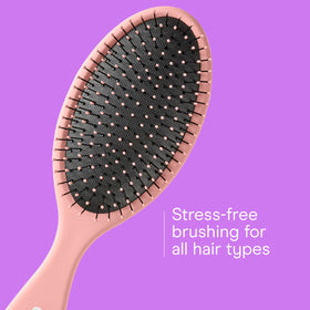 Conair detangling brush set displayed on a bathroom counter