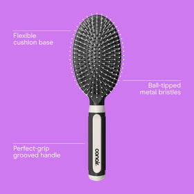 Conair hair brush showing ball-tipped bristles close-up