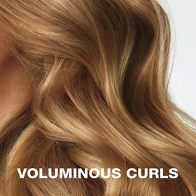 Conair Heatless Curls Extra Large Hair Rollers in use on long hair